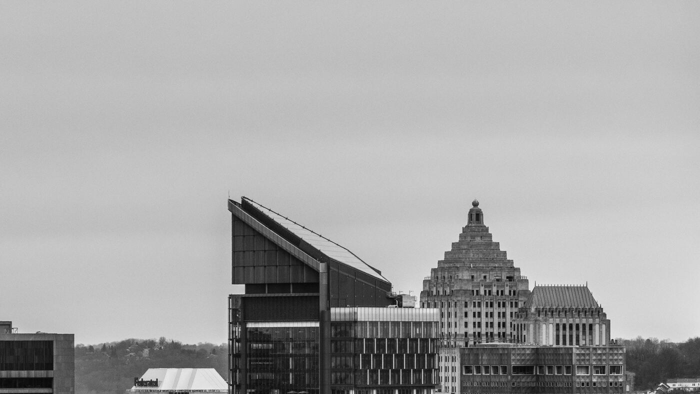 Downtown Pittsburgh skyline under an overcast sky